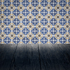 Image showing Wood table top and blur vintage ceramic tile pattern wall