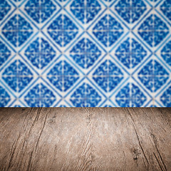 Image showing Wood table top and blur vintage ceramic tile pattern wall