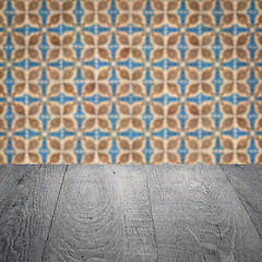 Image showing Wood table top and blur vintage ceramic tile pattern wall