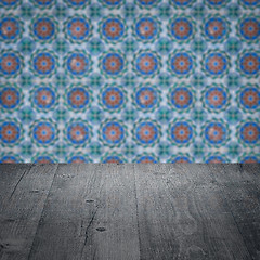 Image showing Wood table top and blur vintage ceramic tile pattern wall