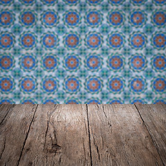 Image showing Wood table top and blur vintage ceramic tile pattern wall