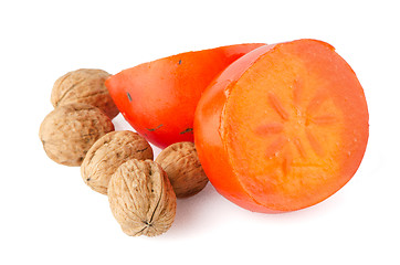 Image showing Ripe persimmons and nuts