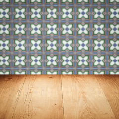 Image showing Wood table top and blur vintage ceramic tile pattern wall