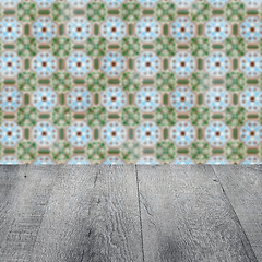 Image showing Wood table top and blur vintage ceramic tile pattern wall