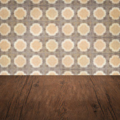 Image showing Wood table top and blur vintage ceramic tile pattern wall