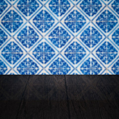 Image showing Wood table top and blur vintage ceramic tile pattern wall