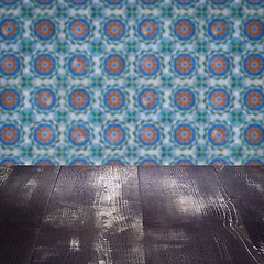 Image showing Wood table top and blur vintage ceramic tile pattern wall