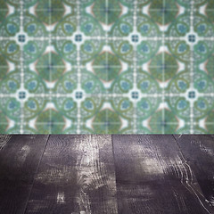 Image showing Wood table top and blur vintage ceramic tile pattern wall