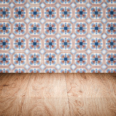 Image showing Wood table top and blur vintage ceramic tile pattern wall