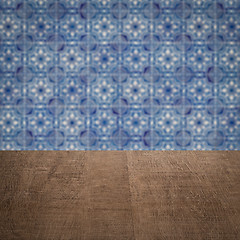 Image showing Wood table top and blur vintage ceramic tile pattern wall