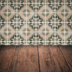 Image showing Wood table top and blur vintage ceramic tile pattern wall