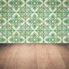 Image showing Wood table top and blur vintage ceramic tile pattern wall