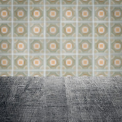 Image showing Wood table top and blur vintage ceramic tile pattern wall