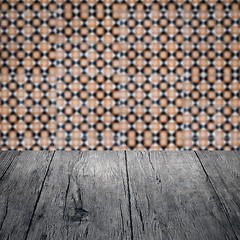 Image showing Wood table top and blur vintage ceramic tile pattern wall