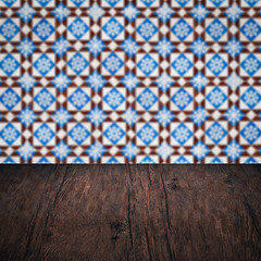 Image showing Wood table top and blur vintage ceramic tile pattern wall