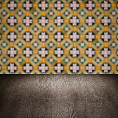 Image showing Wood table top and blur vintage ceramic tile pattern wall