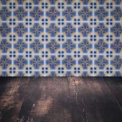 Image showing Wood table top and blur vintage ceramic tile pattern wall