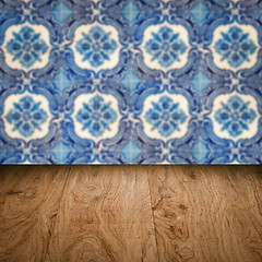 Image showing Wood table top and blur vintage ceramic tile pattern wall