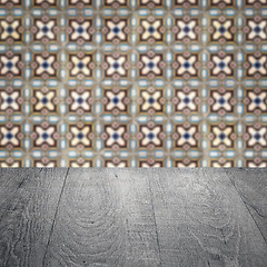 Image showing Wood table top and blur vintage ceramic tile pattern wall