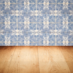 Image showing Wood table top and blur vintage ceramic tile pattern wall