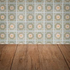 Image showing Wood table top and blur vintage ceramic tile pattern wall