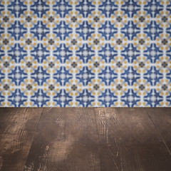 Image showing Wood table top and blur vintage ceramic tile pattern wall