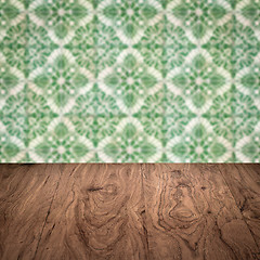 Image showing Wood table top and blur vintage ceramic tile pattern wall