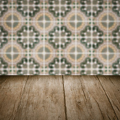 Image showing Wood table top and blur vintage ceramic tile pattern wall