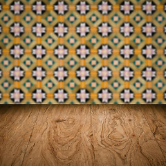 Image showing Wood table top and blur vintage ceramic tile pattern wall