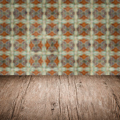 Image showing Wood table top and blur vintage ceramic tile pattern wall