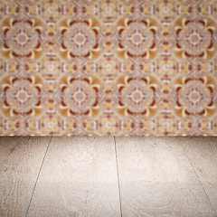 Image showing Wood table top and blur vintage ceramic tile pattern wall