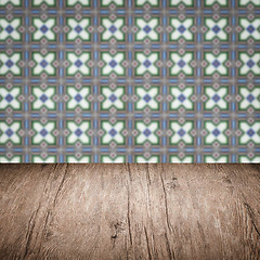 Image showing Wood table top and blur vintage ceramic tile pattern wall