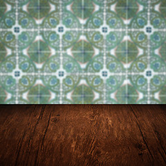 Image showing Wood table top and blur vintage ceramic tile pattern wall