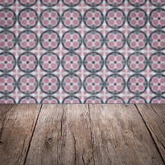 Image showing Wood table top and blur vintage ceramic tile pattern wall