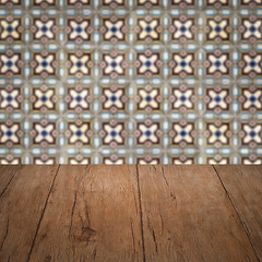 Image showing Wood table top and blur vintage ceramic tile pattern wall