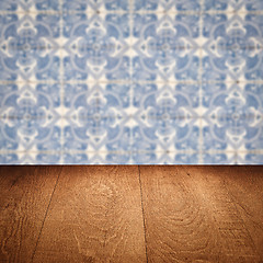 Image showing Wood table top and blur vintage ceramic tile pattern wall