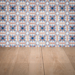 Image showing Wood table top and blur vintage ceramic tile pattern wall