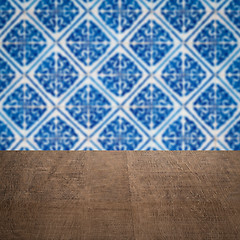 Image showing Wood table top and blur vintage ceramic tile pattern wall