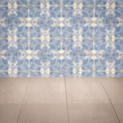 Image showing Wood table top and blur vintage ceramic tile pattern wall