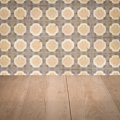 Image showing Wood table top and blur vintage ceramic tile pattern wall