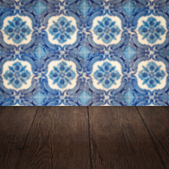 Image showing Wood table top and blur vintage ceramic tile pattern wall