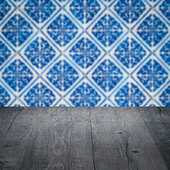 Image showing Wood table top and blur vintage ceramic tile pattern wall