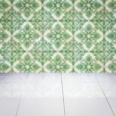 Image showing Wood table top and blur vintage ceramic tile pattern wall