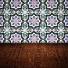 Image showing Wood table top and blur vintage ceramic tile pattern wall