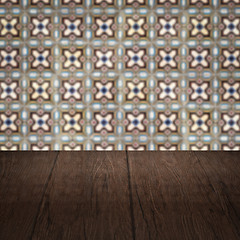 Image showing Wood table top and blur vintage ceramic tile pattern wall