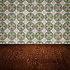 Image showing Wood table top and blur vintage ceramic tile pattern wall