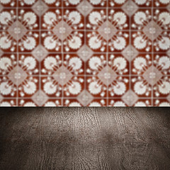 Image showing Wood table top and blur vintage ceramic tile pattern wall