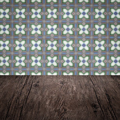 Image showing Wood table top and blur vintage ceramic tile pattern wall