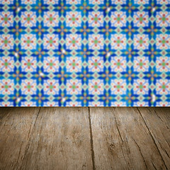 Image showing Wood table top and blur vintage ceramic tile pattern wall