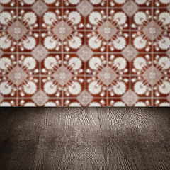 Image showing Wood table top and blur vintage ceramic tile pattern wall